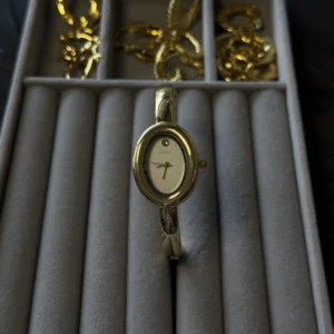 Ellipse shape cuff watch gold
